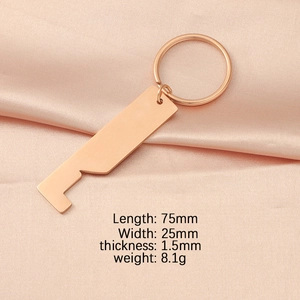 Rose gold bottle opener keychain dimensions 75x25mm and weight 8.1g on pink silk