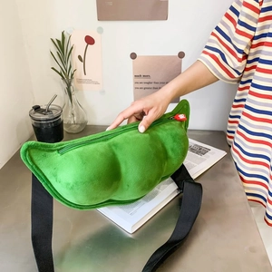 Detail of green plush pea pod bag with smooth zipper and adjustable black strap