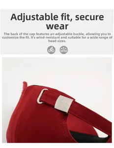 Detail view of red cotton baseball cap featuring an adjustable metal buckle with logo