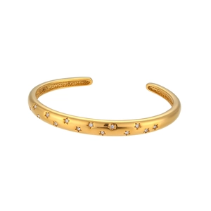 Gold star-shaped engraved open bangle with round white cubic zirconia stones