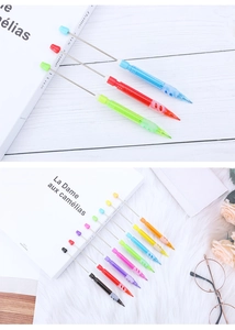 Close-up of colorful DIY beaded mechanical pencils with retractable metal rods for students