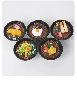 Detailed view of five mini Japanese noodle bowls with realistic shrimp and egg toppings