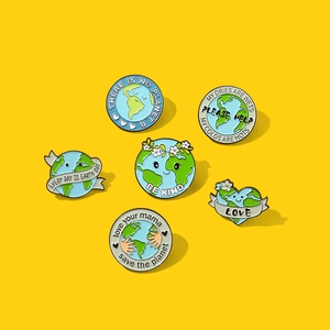 Set of six eco-friendly enamel pins with Earth Day slogans on a bright yellow background