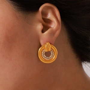 Elegant gold titanium steel hoop earrings with crystal pavé on a model for a chic look