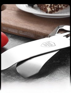 Close-up of SUS 304 stainless steel food tongs with brushed metal texture and 304 stamp