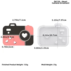 Detailed size comparison of heart camera resin mold and finished silicone casting