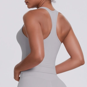 Close-up of racerback design on light gray moisture-wicking athletic tank top