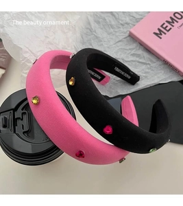 Detail of pink and black sponge headbands with sparkling heart rhinestones