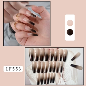 Detailed view of long coffin ombre nails in brown and pink with glitter sparkles