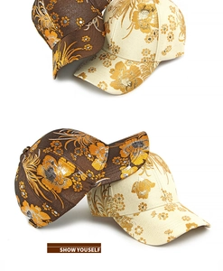 Detailed close-up of premium floral jacquard fabric on retro style baseball caps