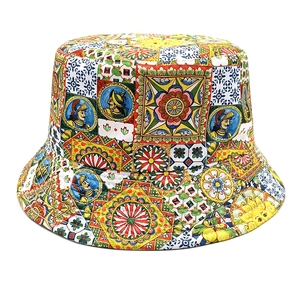 Detail of vibrant Sicilian pattern bucket hat with sun and floral motifs on twill fabric