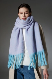 Macro detail of lavender and light blue gradient scarf with soft thick tassels