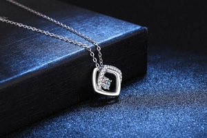 Macro detail of S925 sterling silver geometric square pendant with moissanite stone