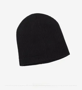 Close-up interior detail view of a black ribbed knit beanie for winter outdoor sports