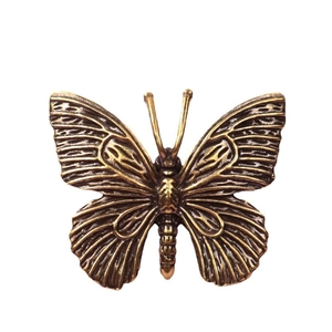 Vintage solid brass butterfly figurine with intricate textured details for home decor