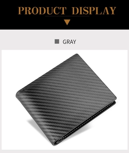 Detailed view of gray carbon fiber bifold wallet with white stitching and bifold design
