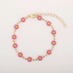 Detail of gold daisy bracelet with pink enamel petals and adjustable lobster clasp chain