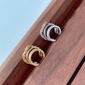 Detailed view of S925 sterling silver triple layered ear cuffs in gold and silver finish