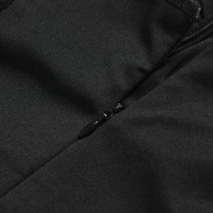 Close-up of invisible zipper closure on black lace bodycon dress with fine fabric texture