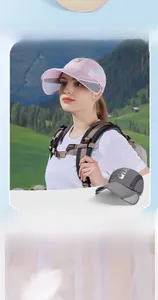 Detail of pink and gray sun hats featuring breathable mesh lining and retractable wide brims