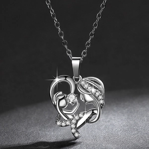 Silver heart-shaped necklace with mother and child silhouette and sparkling zircons