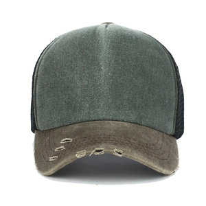 Detail of distressed brim and breathable mesh on vintage washed baseball trucker hat