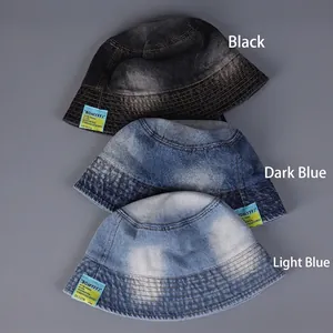 Three gradient washed denim bucket hats in black and blue shades with wide brims