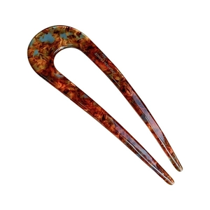 U-shaped hair pin with tortoise shell pattern and Creation France engraving on white background
