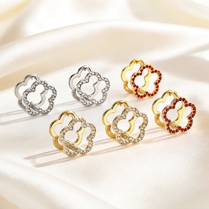 Minimalist geometric hollow flower earrings in gold and silver with white and red zircon