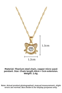 Detailed view of cat-shaped gold pendant with sparkling zircon and titanium steel chain