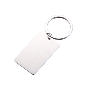 Polished silver stainless steel rectangular pendant keychain on a minimalist white background