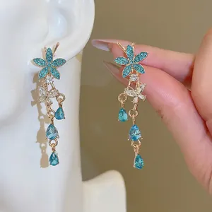 Elegant blue crystal flower earrings with dangling waterdrop tassels and gold frame