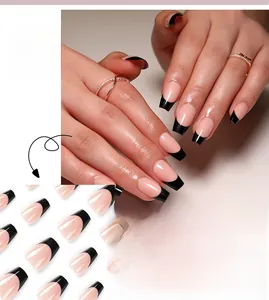 Detail of nude French press-on nails with elegant black tips and high-gloss finish