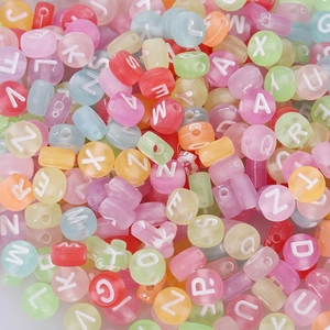 Close-up of colorful acrylic alphabet beads for DIY jewelry making and educational crafts