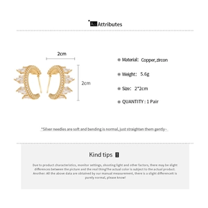 Detail showing dimensions and material specs of golden C-shaped zircon earrings