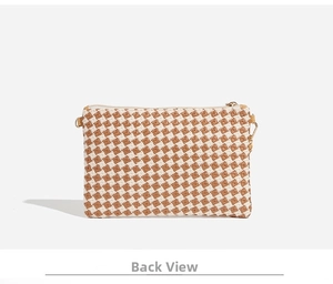 Detail view of the woven brown and white checkered pattern back with metal zippers
