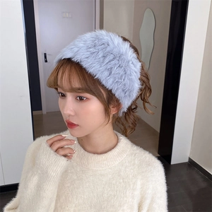 Detail of soft light blue faux fur headband with fluffy texture for winter warmth