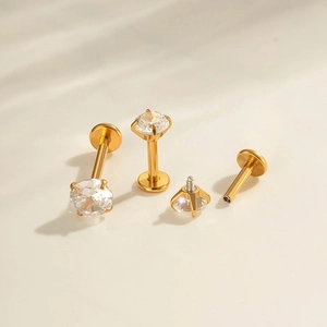 Polished gold stainless steel labret stud with a 4-claw set clear round zircon gemstone