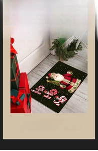 Detailed view of Santa Claus Christmas doormat with HO HO HO text on green background