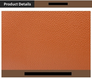 Close-up of orange brown lychee grain leather material showing fine texture details