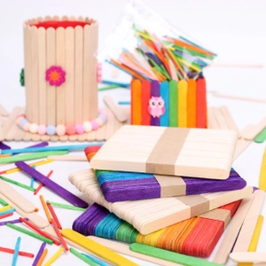 Close-up of vibrant multi-colored wooden sticks for DIY crafts and handmade pen holders