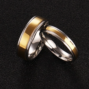 Polished gold and silver stainless steel couple rings with frosted finish and diamond