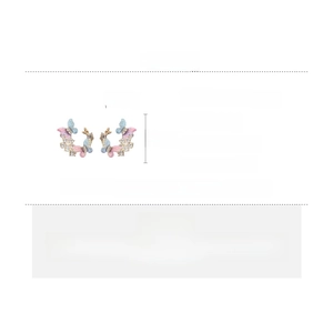 Detail view of colorful rhinestone butterfly earrings with silver pins and alloy base