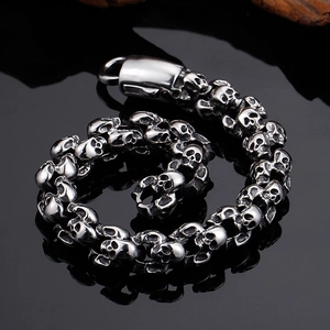 Macro view of stainless steel skull bracelet with vintage punk texture and metal clasp