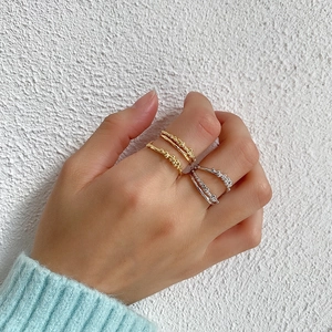 Three-piece stackable ring set with bubble textures in gold and silver finish