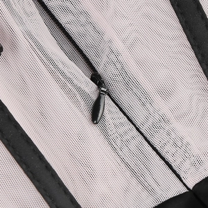 Detailed macro view of black invisible zipper on white mesh fabric of the dress
