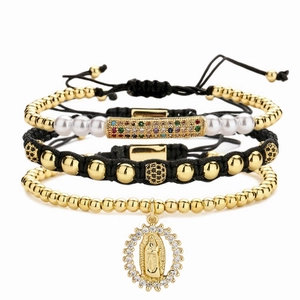 Four-piece stackable bracelet set with gold beads, zircon bars and religious pendant