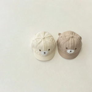 Detail of cream and light brown cotton baby baseball caps with 3D ears and bear embroidery