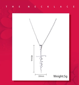Close-up of silver faith cross pendant with 40x18mm dimensions and 5g weight details
