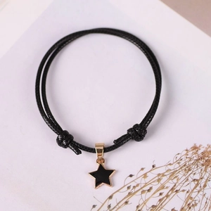 Adjustable black cord bracelet with a gold-edged pentagram star pendant for men and women